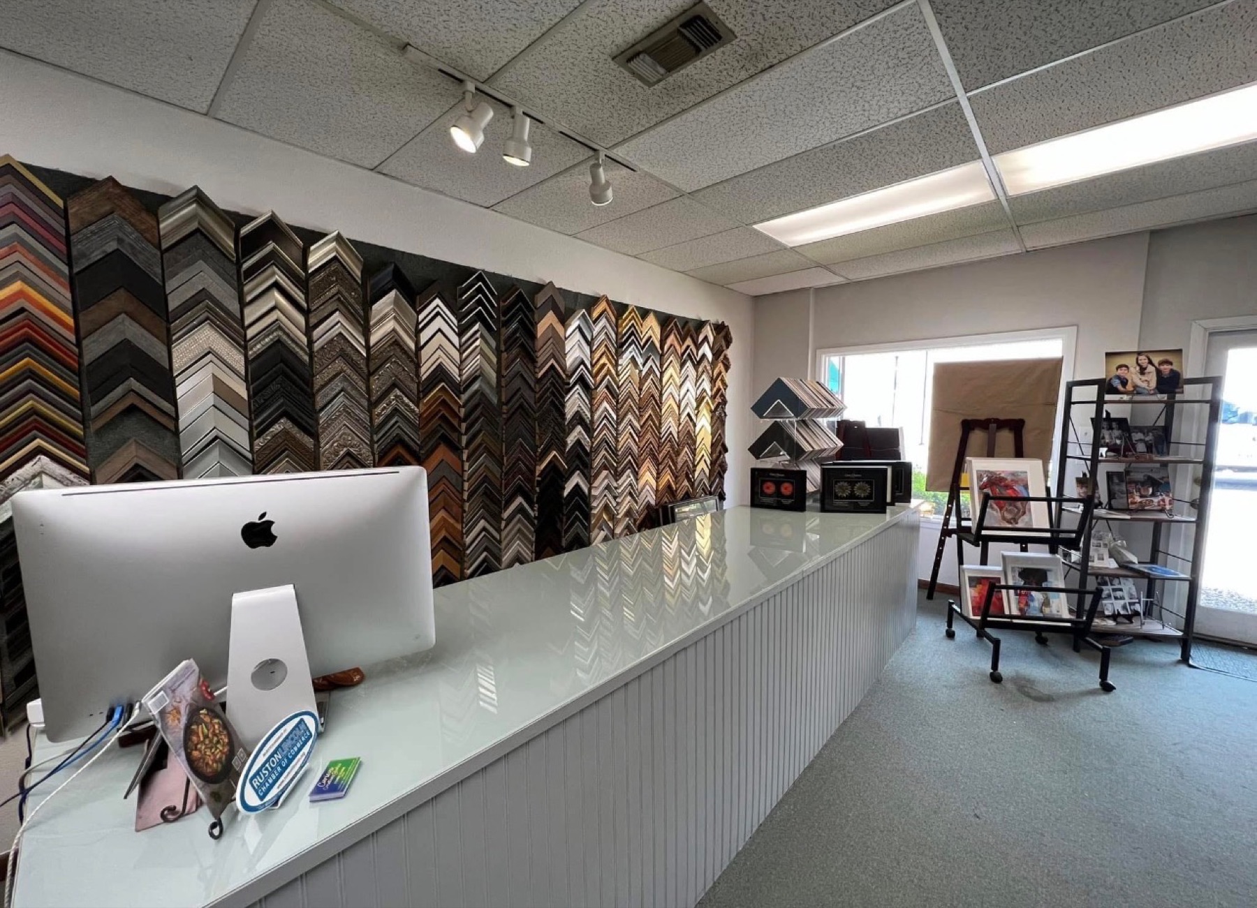 The Frame Up counter, moulding wall, and shop interior on Vienna Street in Ruston, Louisiana